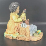 Vintage Young's Inc. African American Girl playing with a Doll and Teddy Bear.