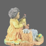 Vintage Young's Inc. African American Girl playing with a Doll and Teddy Bear.