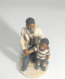 Heartfelt Healing - Vintage African American Pediatrician Statue - Examining a Standing Boy.