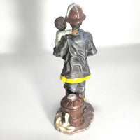 Vintage figurine - African American The Red Hat Fireman - Rescuer a Baby.